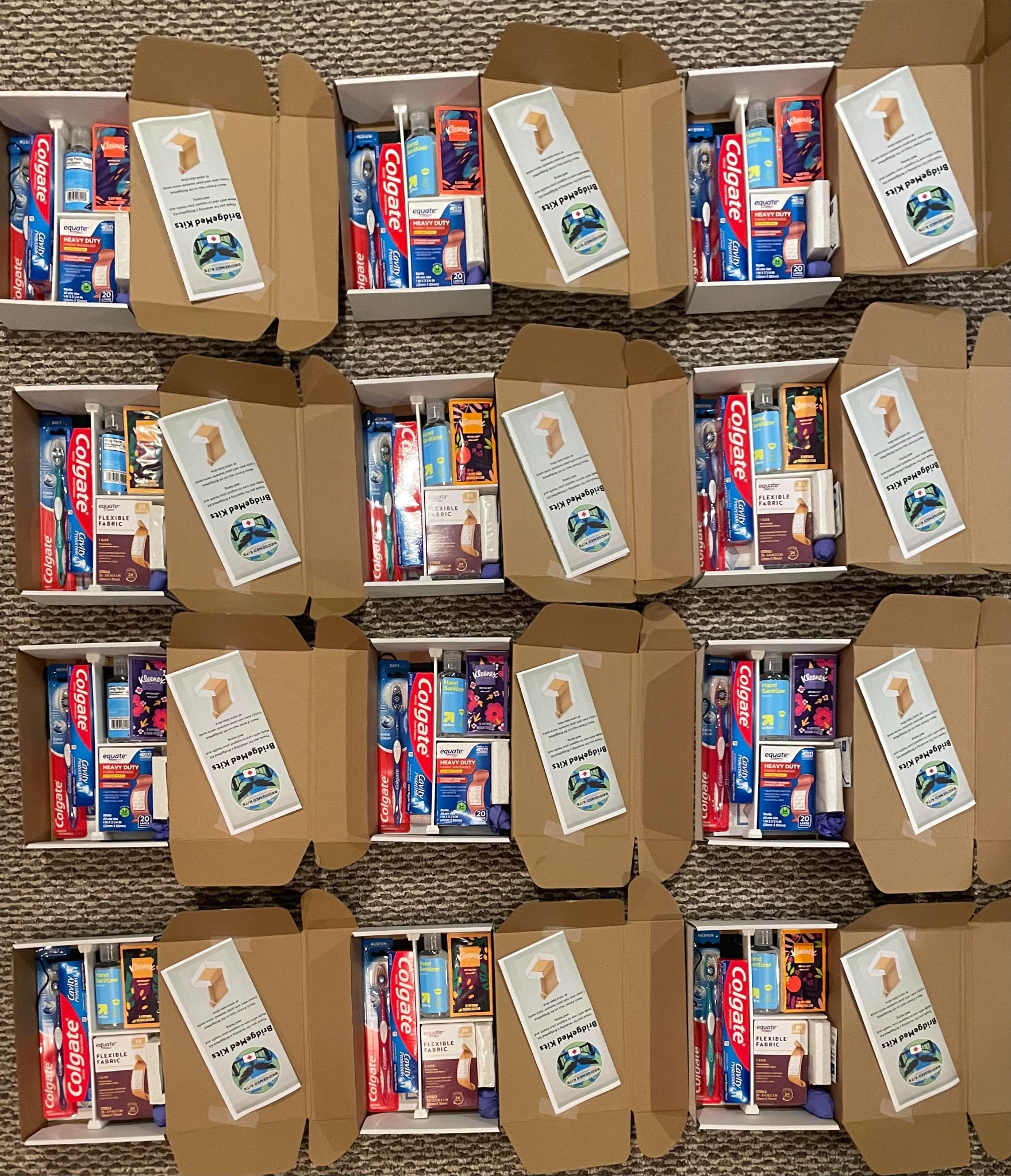 Twelve packed BridgeMed Kits ready for shipment